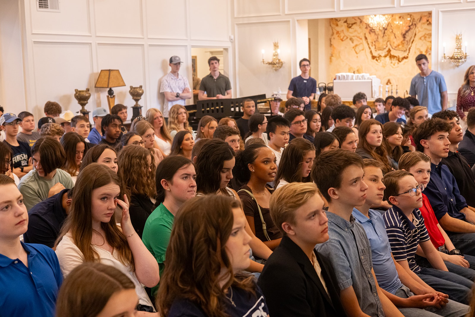 Young attendees listening at a Youth Leadership event